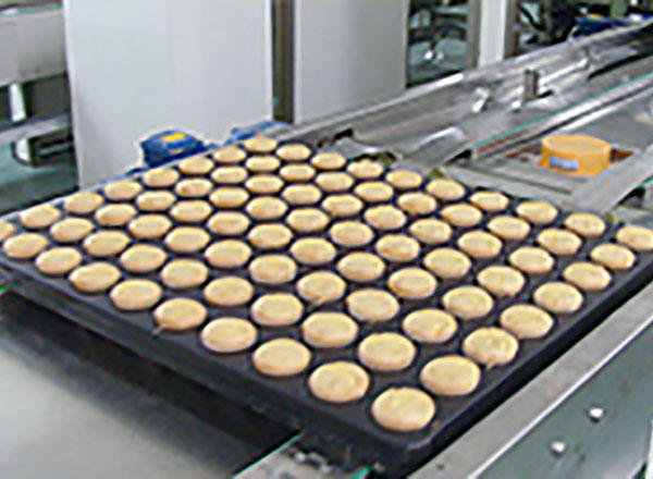 What should be done when cleaning the biscuit production line